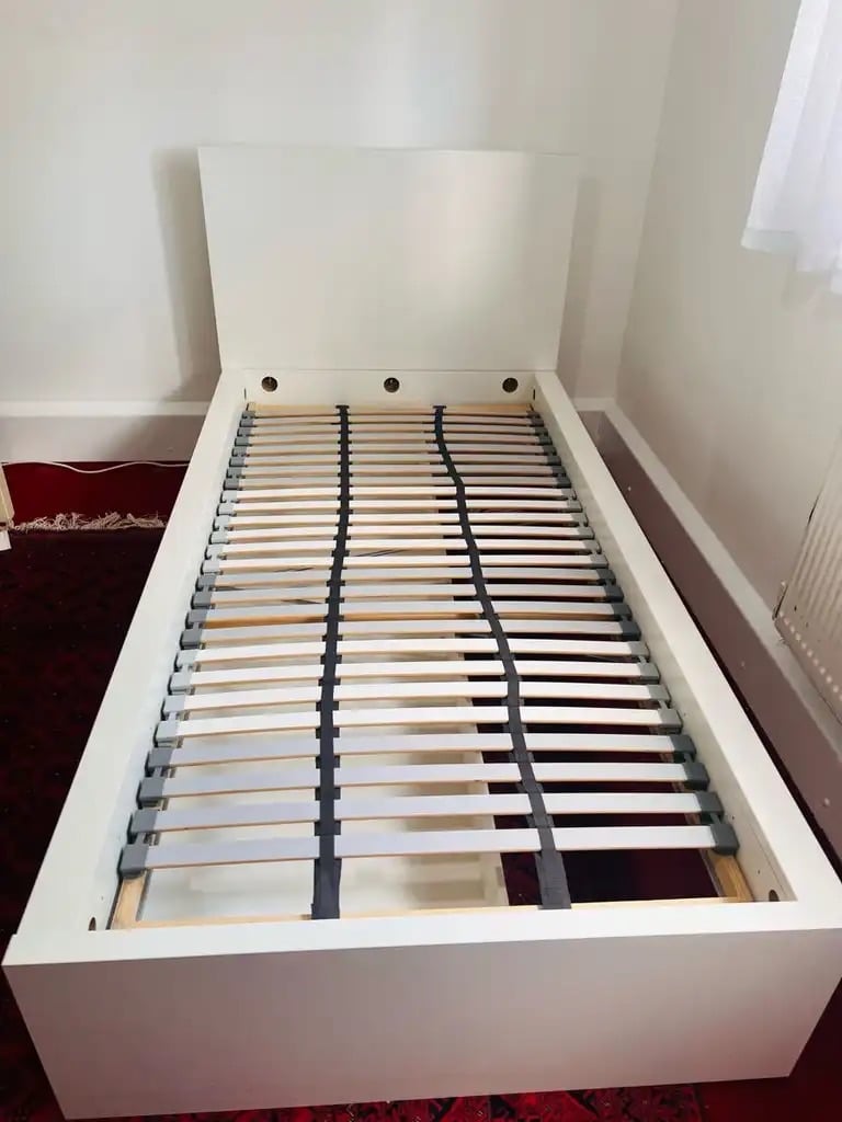 Ikea bed with storage drawers and slated bed base