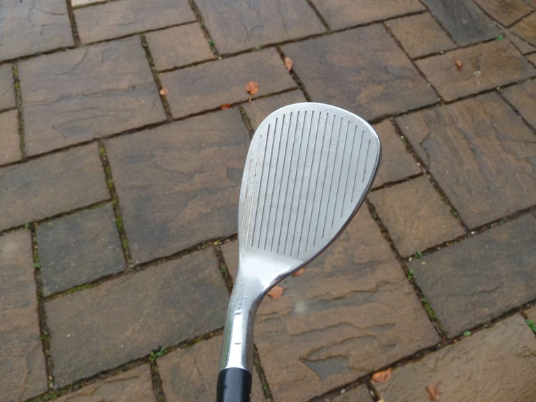 Callaway "SURE OUT 2" 64 degree sand wedge.