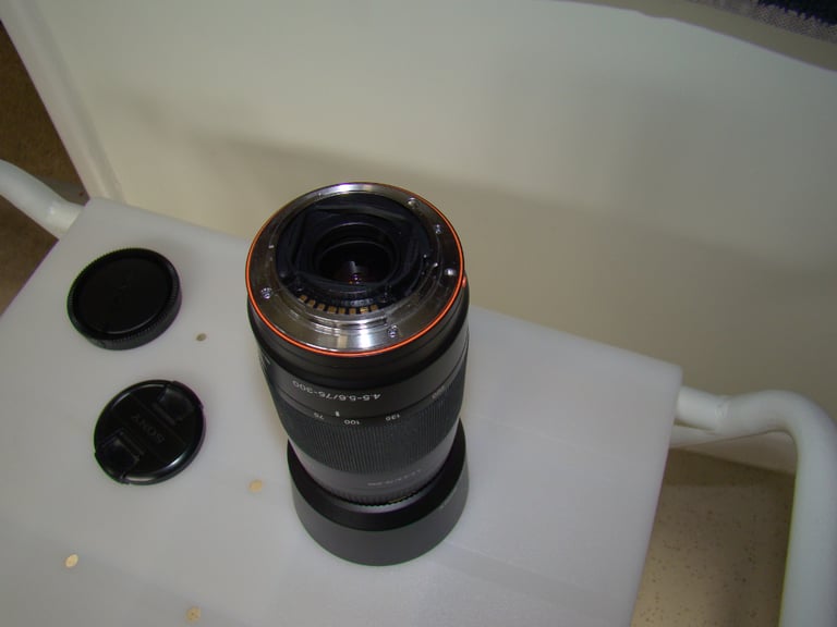 sony 70 to 300mm lens with hood and end covers. E fitting.