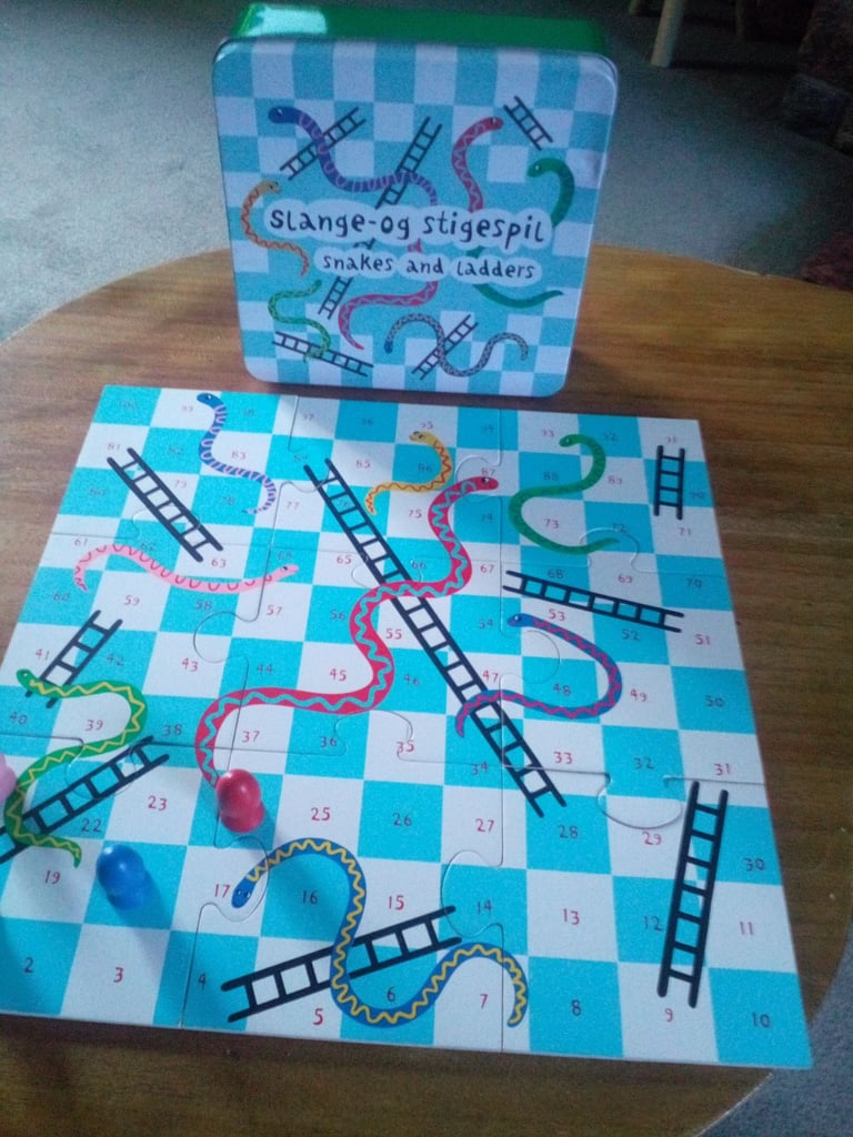 Unusual snakes and ladders board game