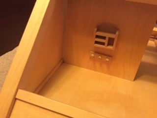 Wooden dolls house with furniture 