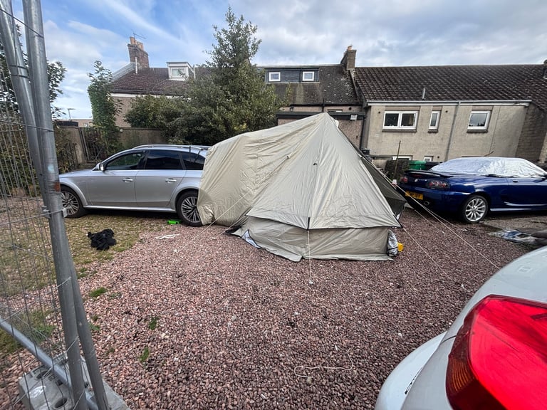 Car bell tent with log burner 