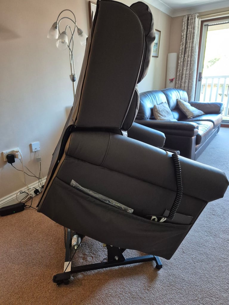Careco electric riser/recliner brown leather chair 