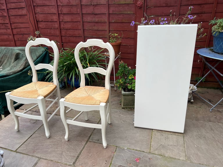 M&S Dining Table - Cream with wicker chairs. six chairs and an extender