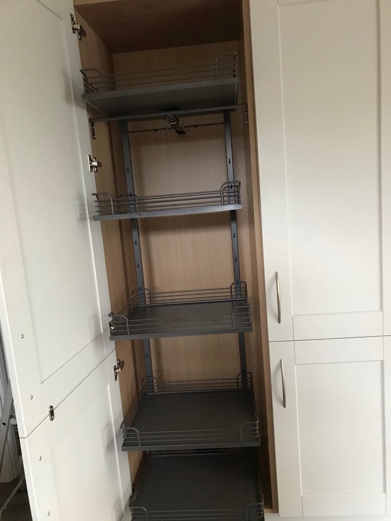 Larder cupboard interior pullout baskets