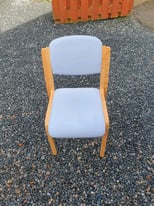 Blue fabric chair with wooden legs
