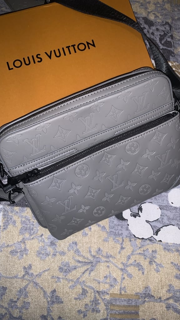L V Messneger bag