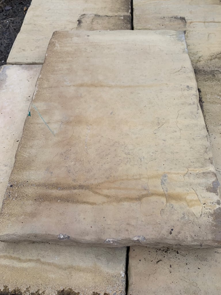 25 buff paving slabs