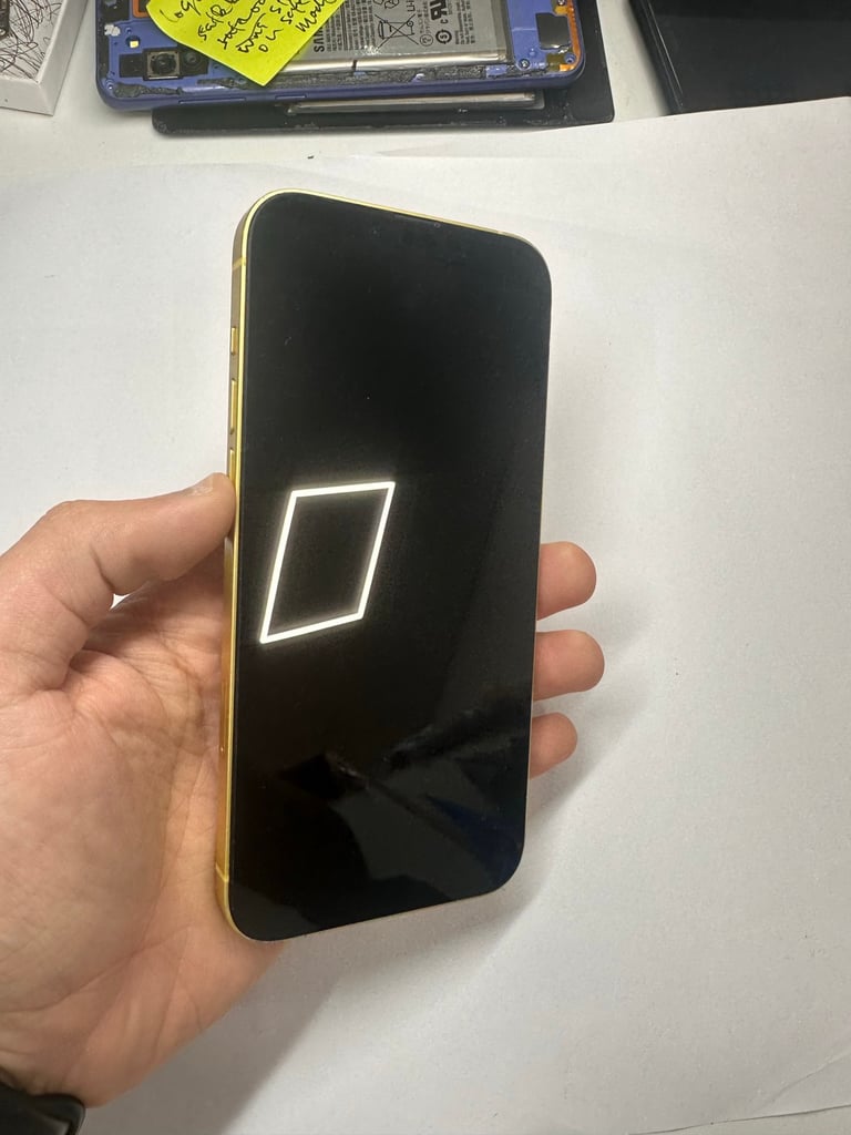 Yellow iPhone 14 Plus in good condition at phone shop 