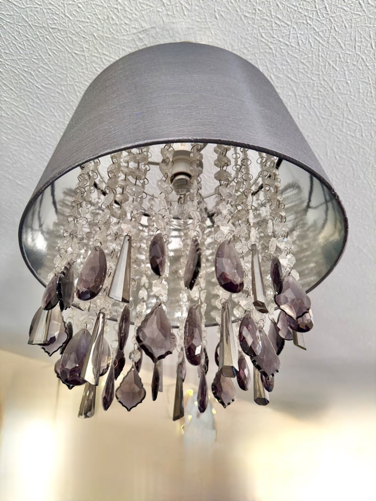 Grey pleated satin shade with drop cristals Measuring 35x 35 cm. Drop crystal plastic 