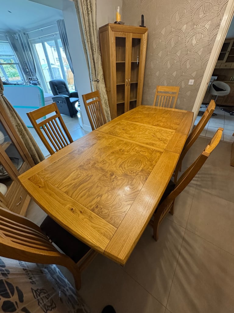 Extending Oak Dining Table with 8 matching chairs