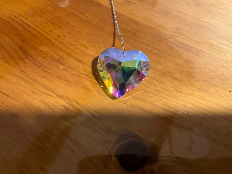 STUNNING CHRISTAL HEART. Prisms reflect the light and colours. Difference places different colours 