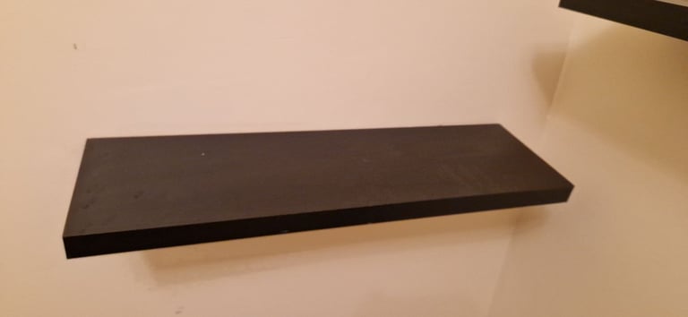 2 black floating shelves