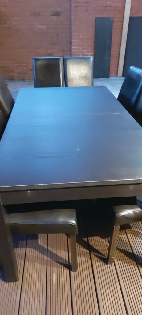 Large table and 12 brown chairs