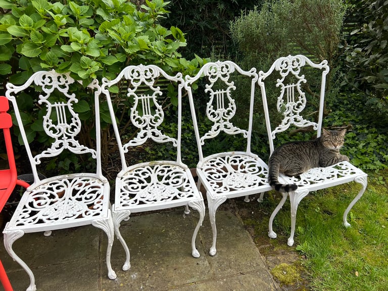 Cast iron garden chairs x 4 