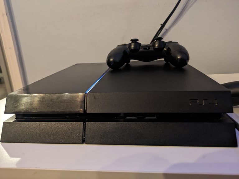 PlayStation 4 console and two controllers 