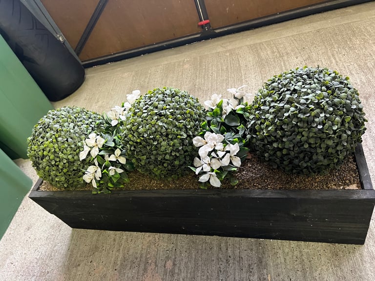 Fake plant in planter 