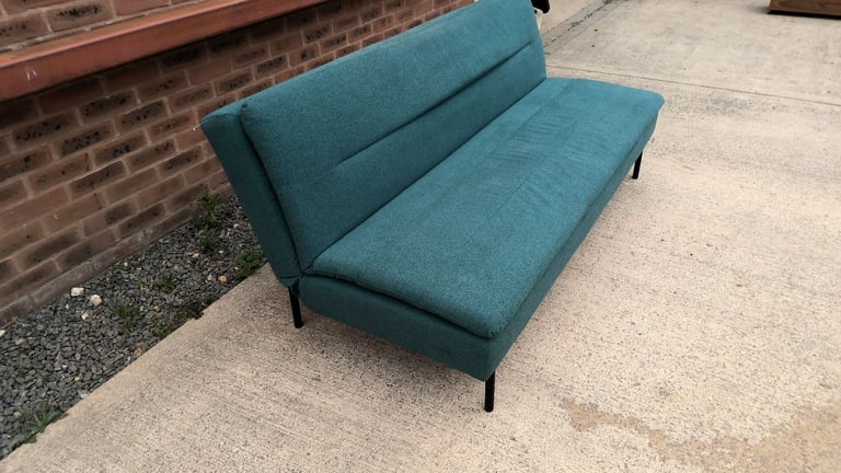 green 2 seater sofa that folds down to be a sofa bed 