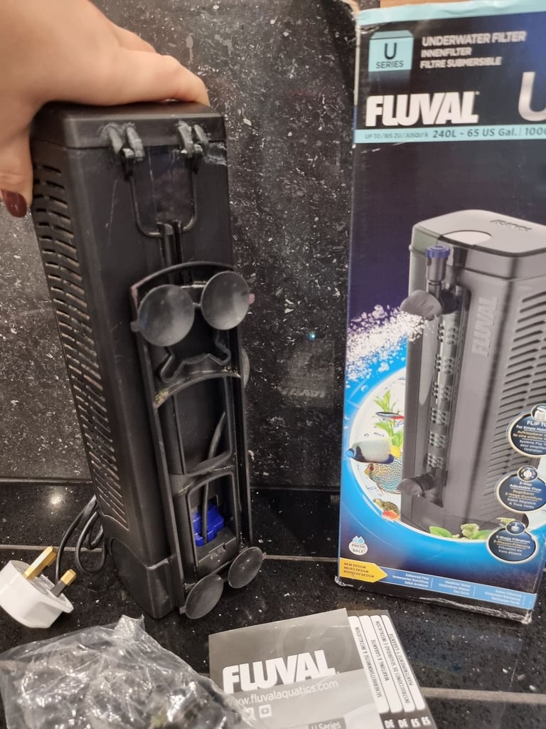 Fluval U4 underwater filter, thermometer and faux stone decoration