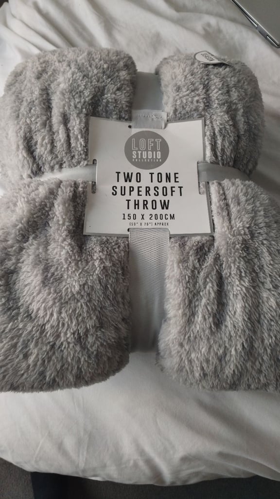 Fleece throw, brand new.