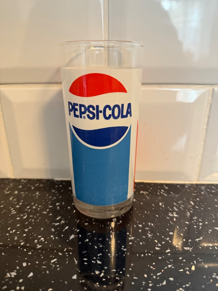 This vintage 1970's Pepsi Cola drinking glass features a striking 3-sided logo in red white & blue