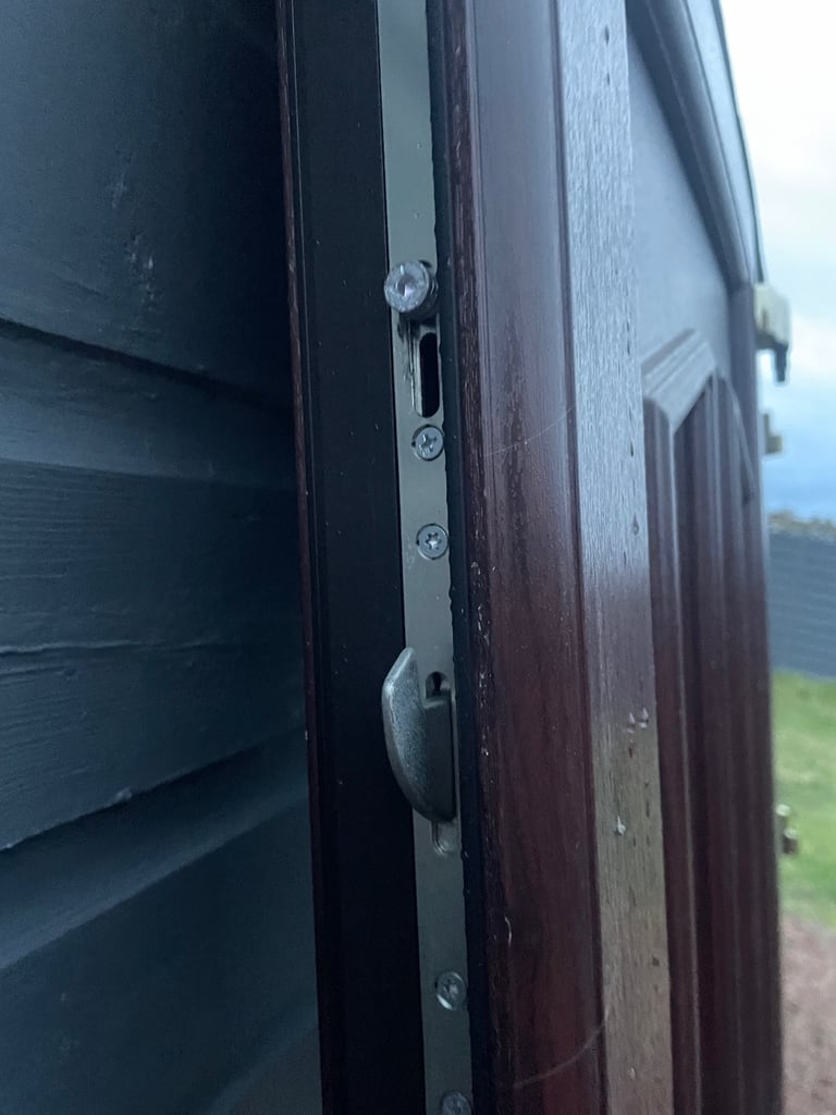 Upvc front door in rosewood 