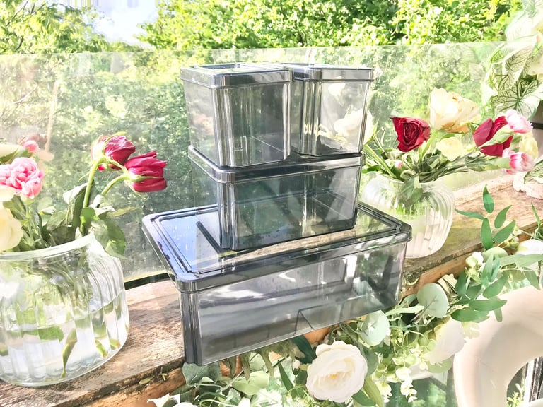 Good quality. Set of 4 Black tint plastic storage boxes Only used a few times