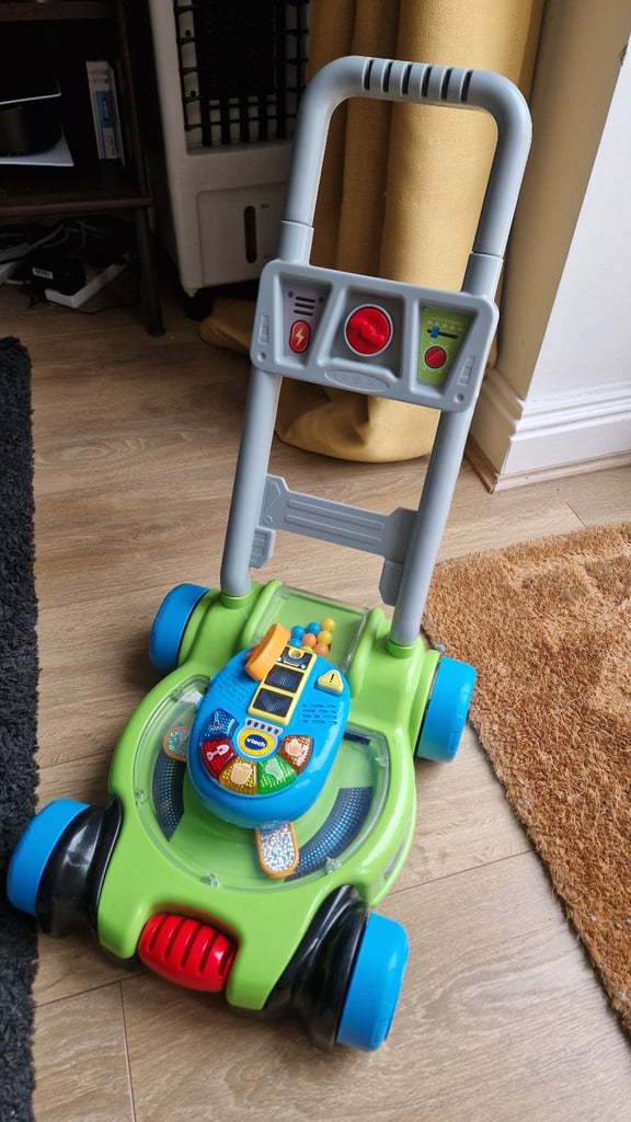 Vtech pop and spin lawn mower child's play interactive push along