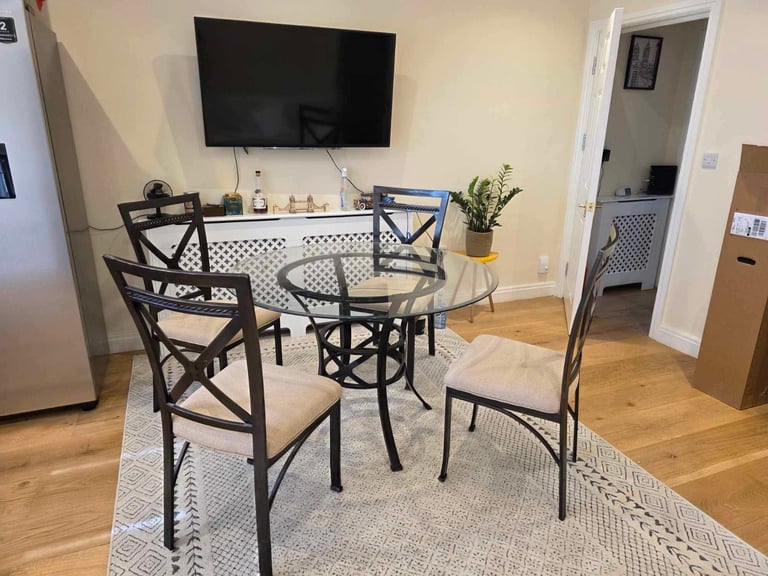 image for Stylish Glass Dining Table with 4 Cushion Chairs - £120