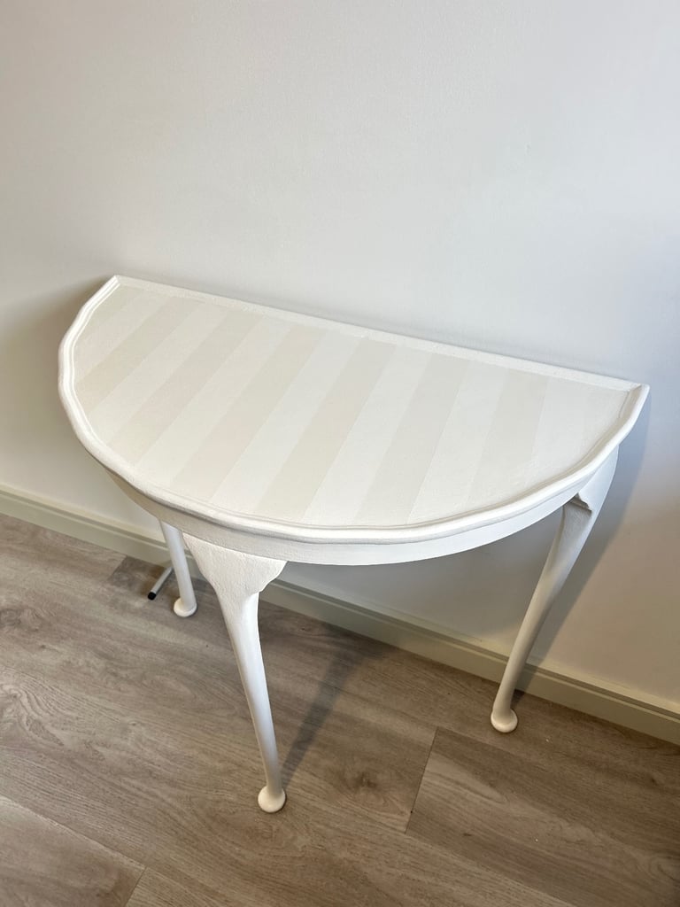 Elegant refinished hall table with ghost stripes