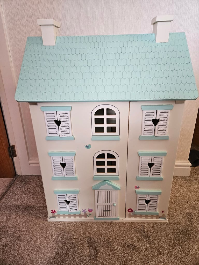 Light up dolls house with dolls and accessories