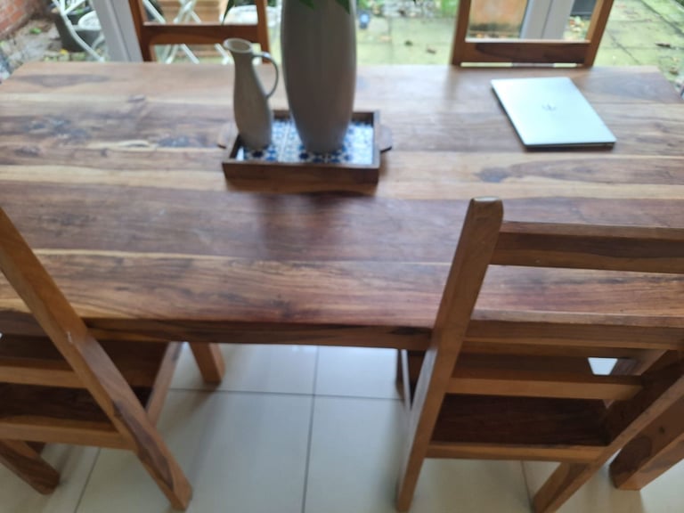 High quality natural tropical hardwood dining room table and chairs.