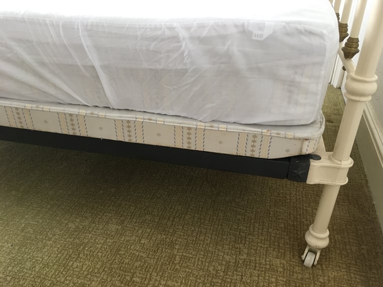 Vintage French brass & cream cast iron single bed on brass & china castors 