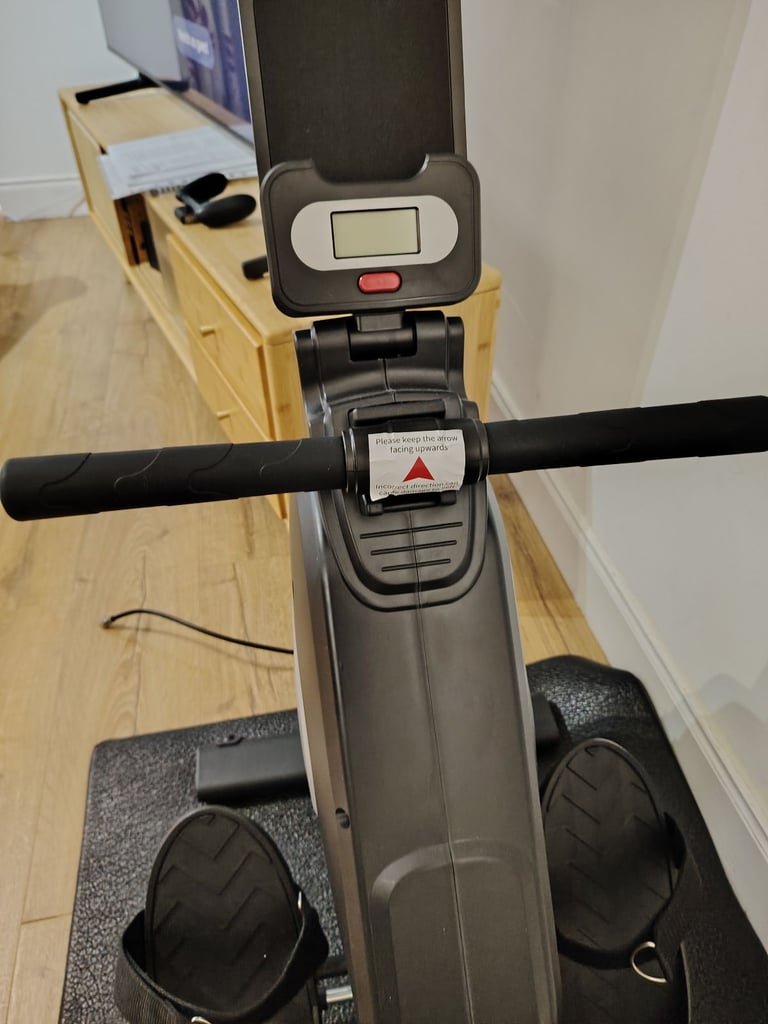 Nearly new rowing machine with mat