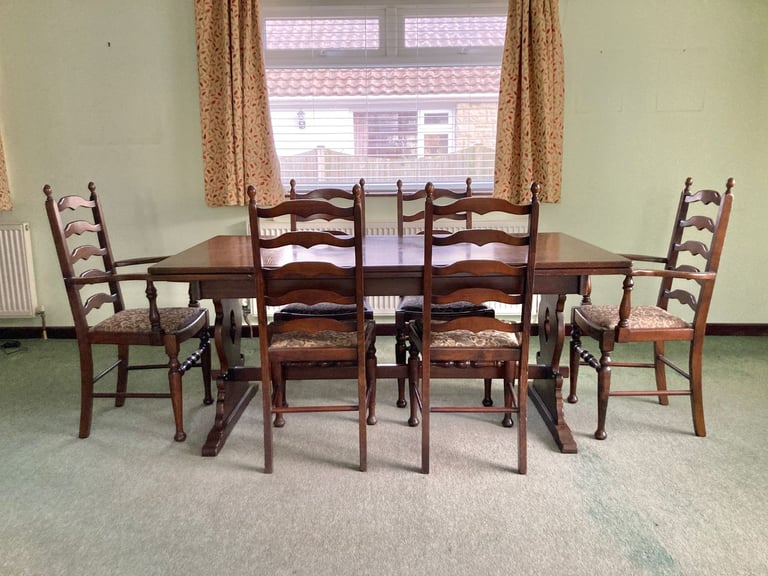 Dark mahogany finish dining table and six chairs