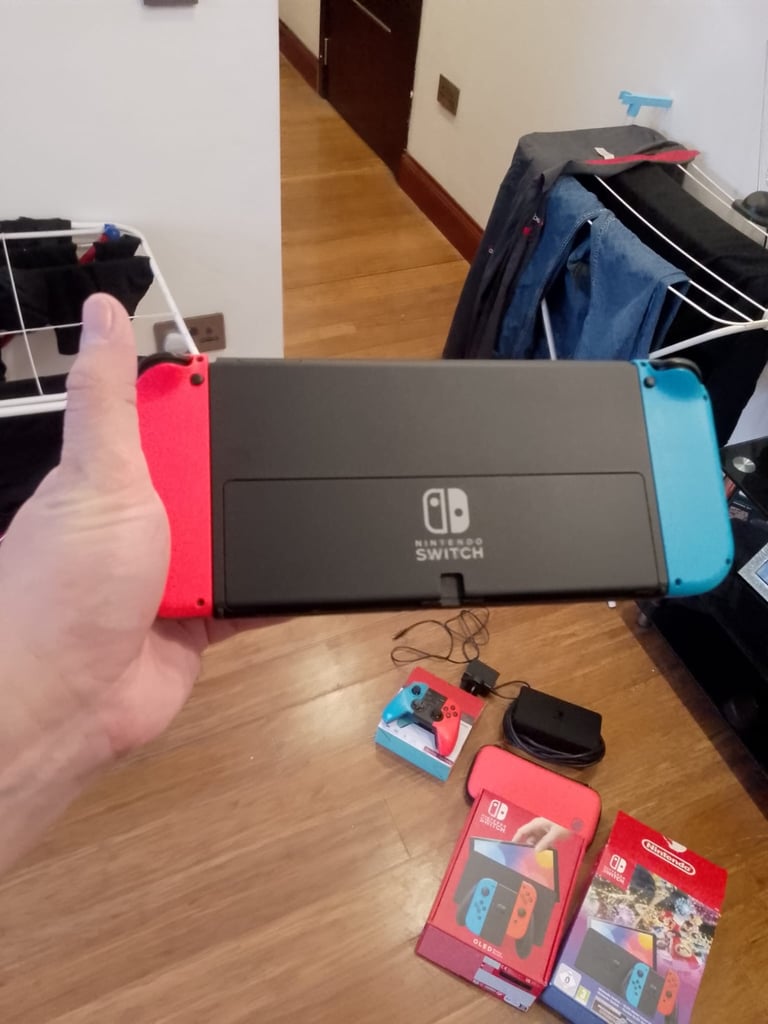 Nintendo Switch – OLED Model (Neon Blue/Neon Red) 64GB storage with box, controller and carry case