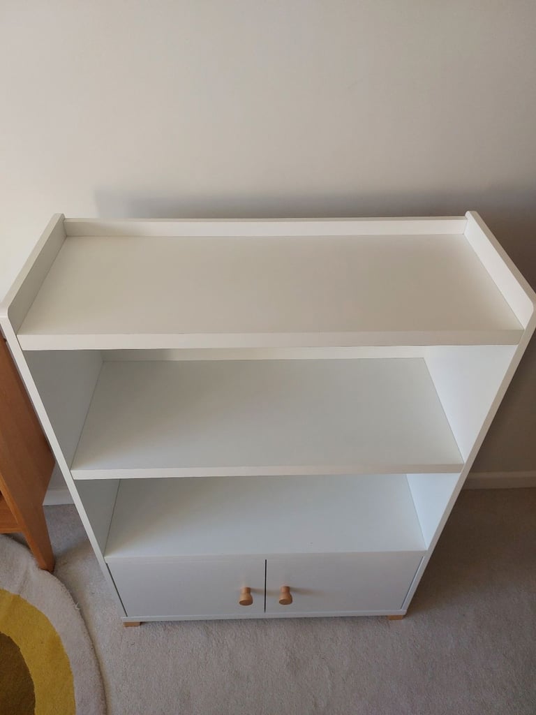 Child's room white bookcase with cupboard