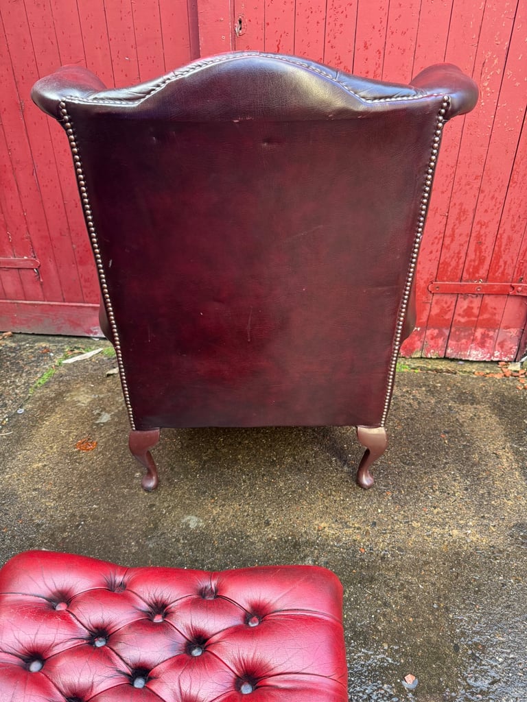 Chesterfield Leather wingback armchair and matching footstool