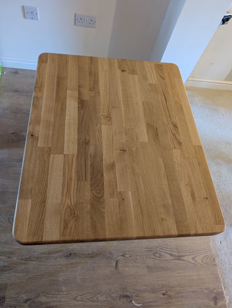 Solid Oak dinner table with cast iron base