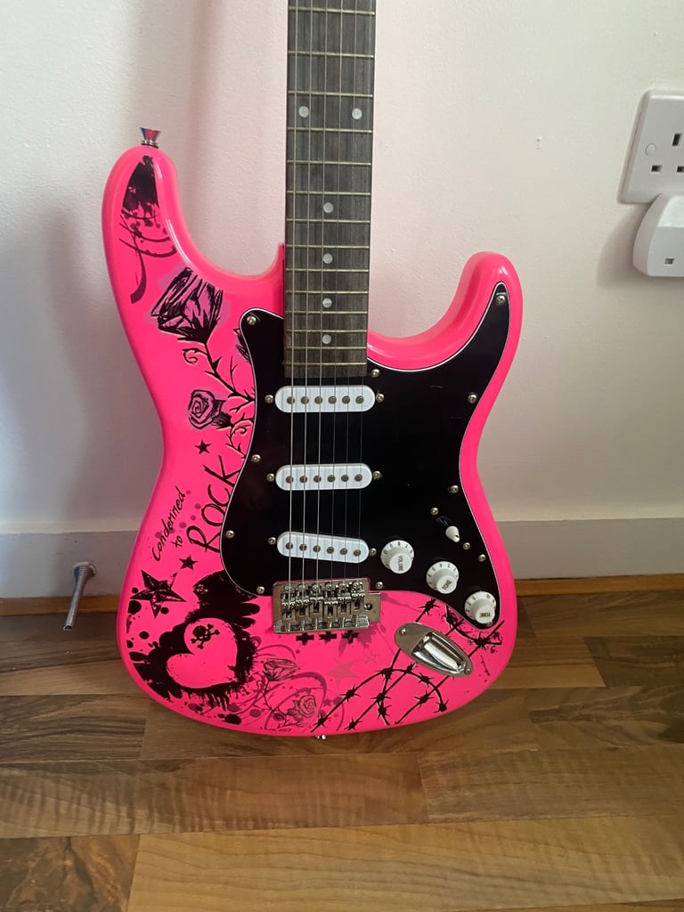 Pink jaxville electric guitar with nylon case 