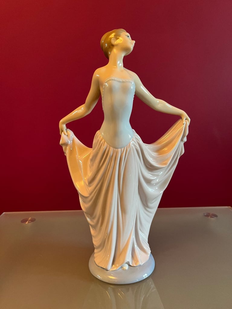 image for Lladro Female Figurine, outstretched arms holding her dress