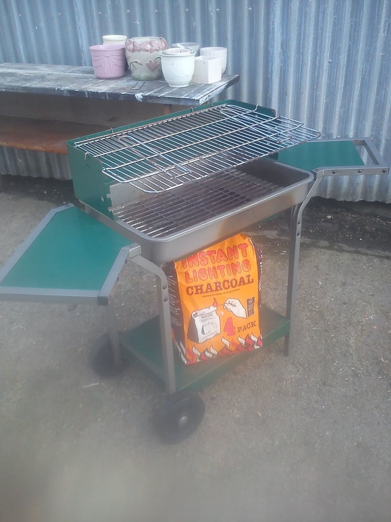 image for Barbecue with detachable shelves and bag of charcoal.