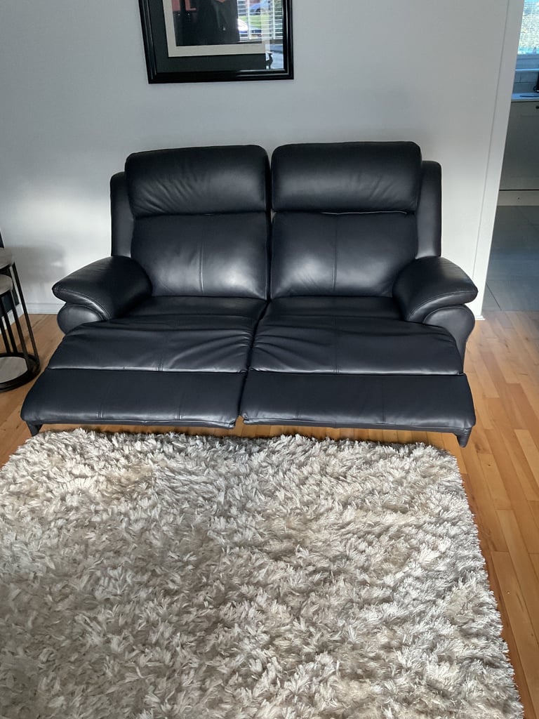 REDUCED PRICE    NEW 2 x 2 seater leather sofas 1 of which is a power recliner