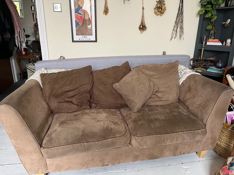 Brown suede three seater sofa. 