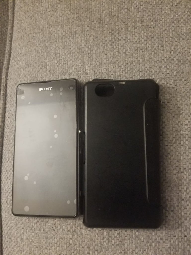 Black sony mobile with charger