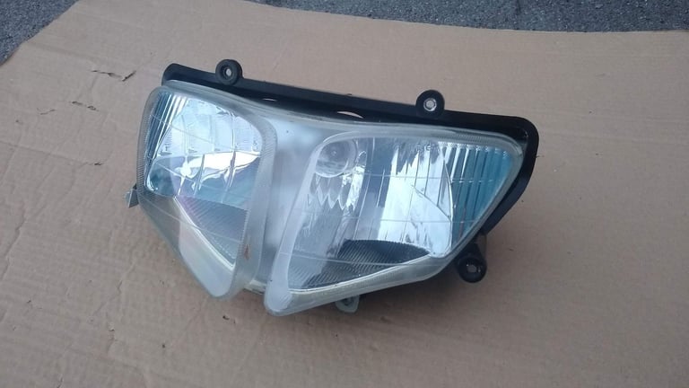 image for PGO T-Rex moped scooter headlight, new condition.