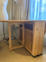 Wooden folding table with four folding chairs (John Lewis)