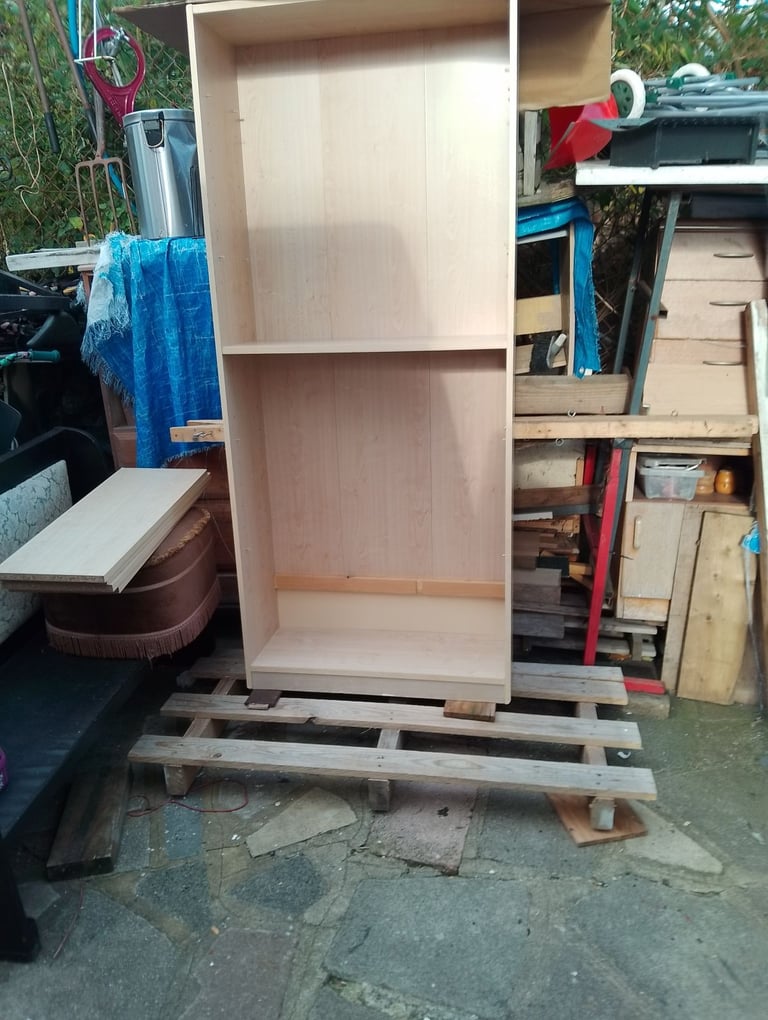 Very tall shelving unit in new condition spotlessly clean inside and out 