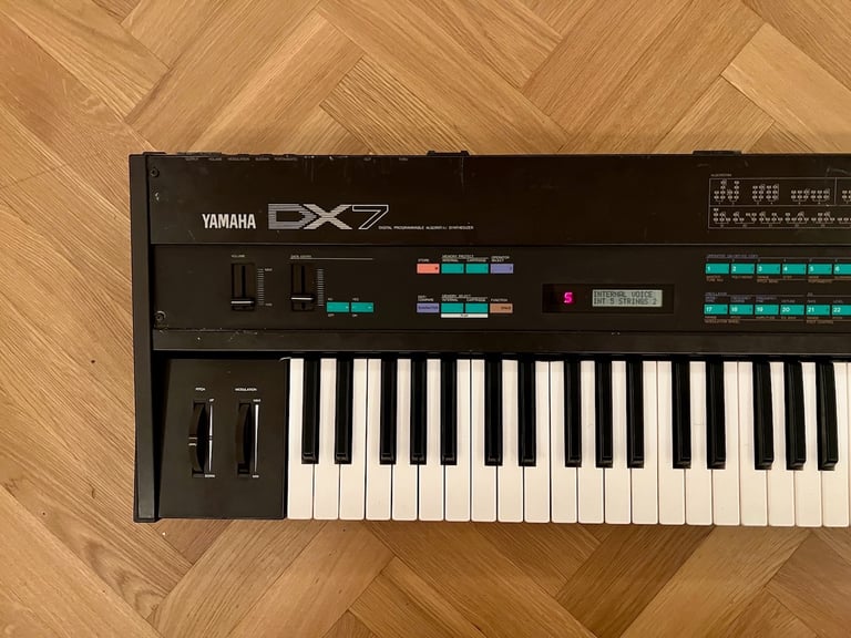Yamaha DX7 Synthesizer Mk1 with original stand, soft case and manual.