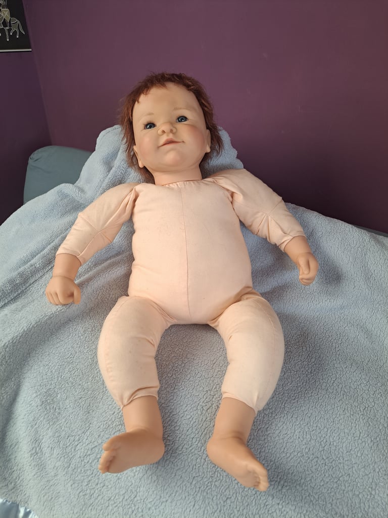 Collectable baby dolls and antique style pram